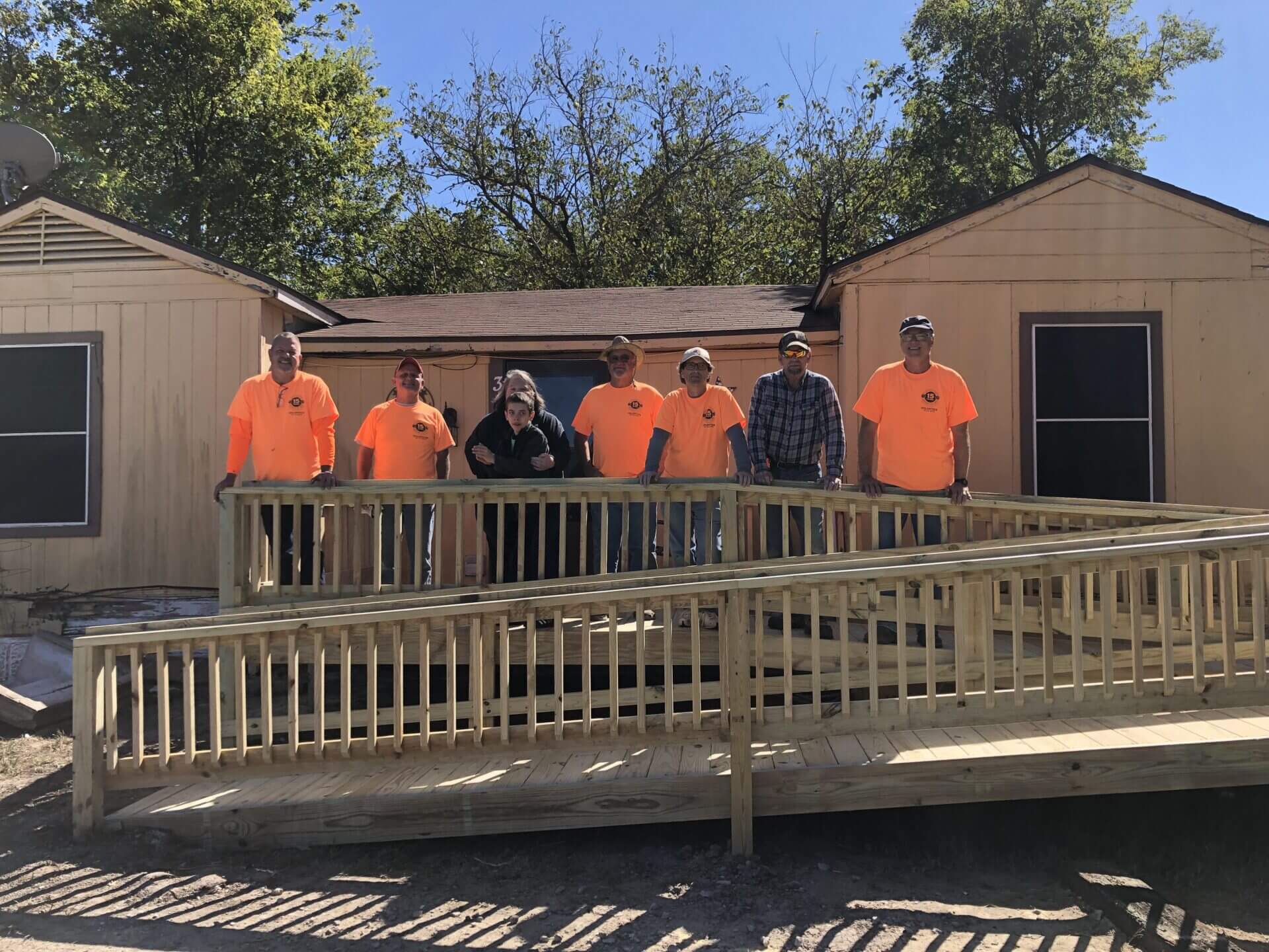 People wearing an orange uniform